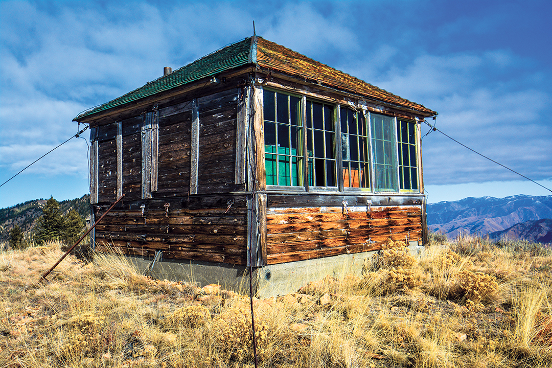 An old fire lookout still stands guard today over public land where wildfires create perfect elk habitat.
